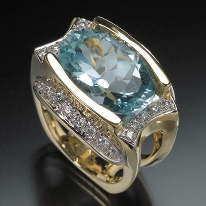 Light Blue Oval Zircon With Diamond Ring
